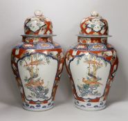 A pair of Imari vases and covers. 39cm high