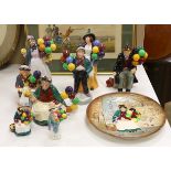 Seven Royal Doulton balloon seller figures in various sizes, a similar teapot and a dish (9),