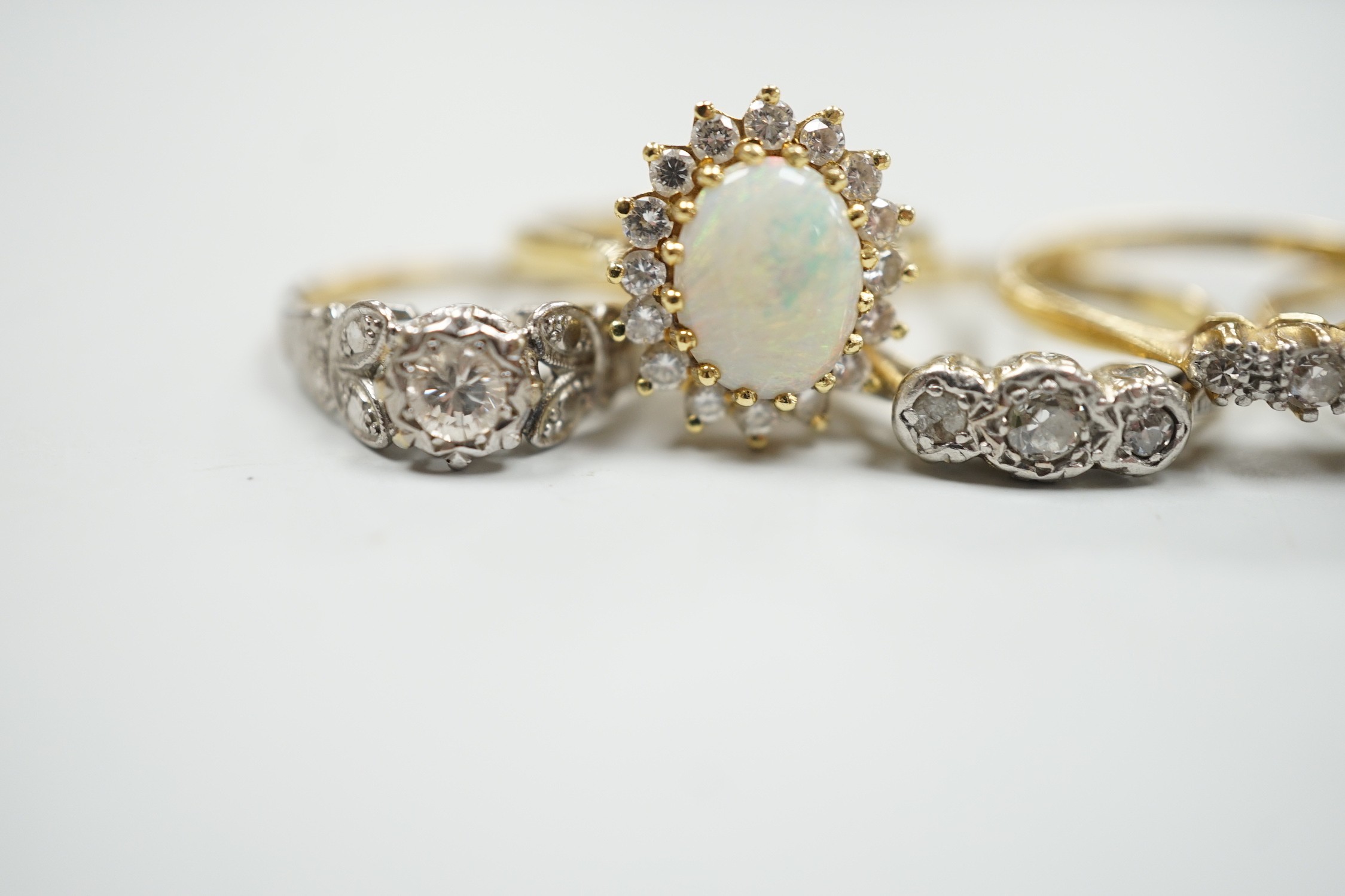 Four assorted 18ct and gem set dress rings, including white opal and diamond and two three stone - Image 4 of 5