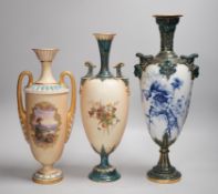 Three Royal Worcester pedestal vases, each of ovoid form and supported on circular pedestal feet,