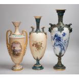 Three Royal Worcester pedestal vases, each of ovoid form and supported on circular pedestal feet,