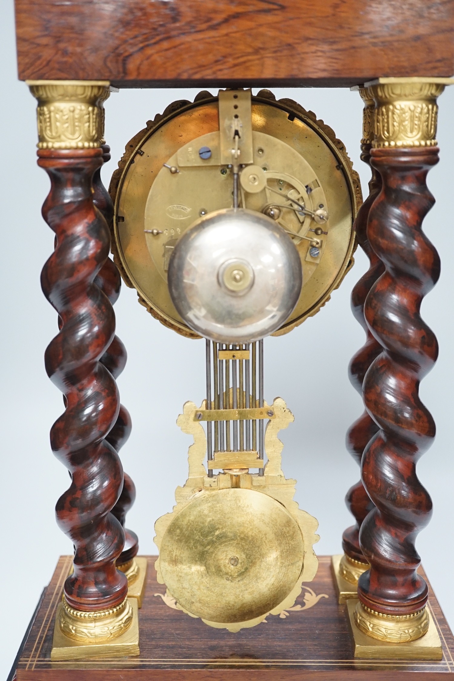 A 19th century Napoleon III rosewood inlaid and ormolu mounted portico clock, 47cms high - Image 4 of 4