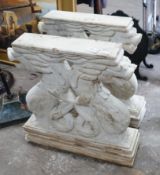 A pair of carved stone serpent table supports, width 75cm, height 78cm