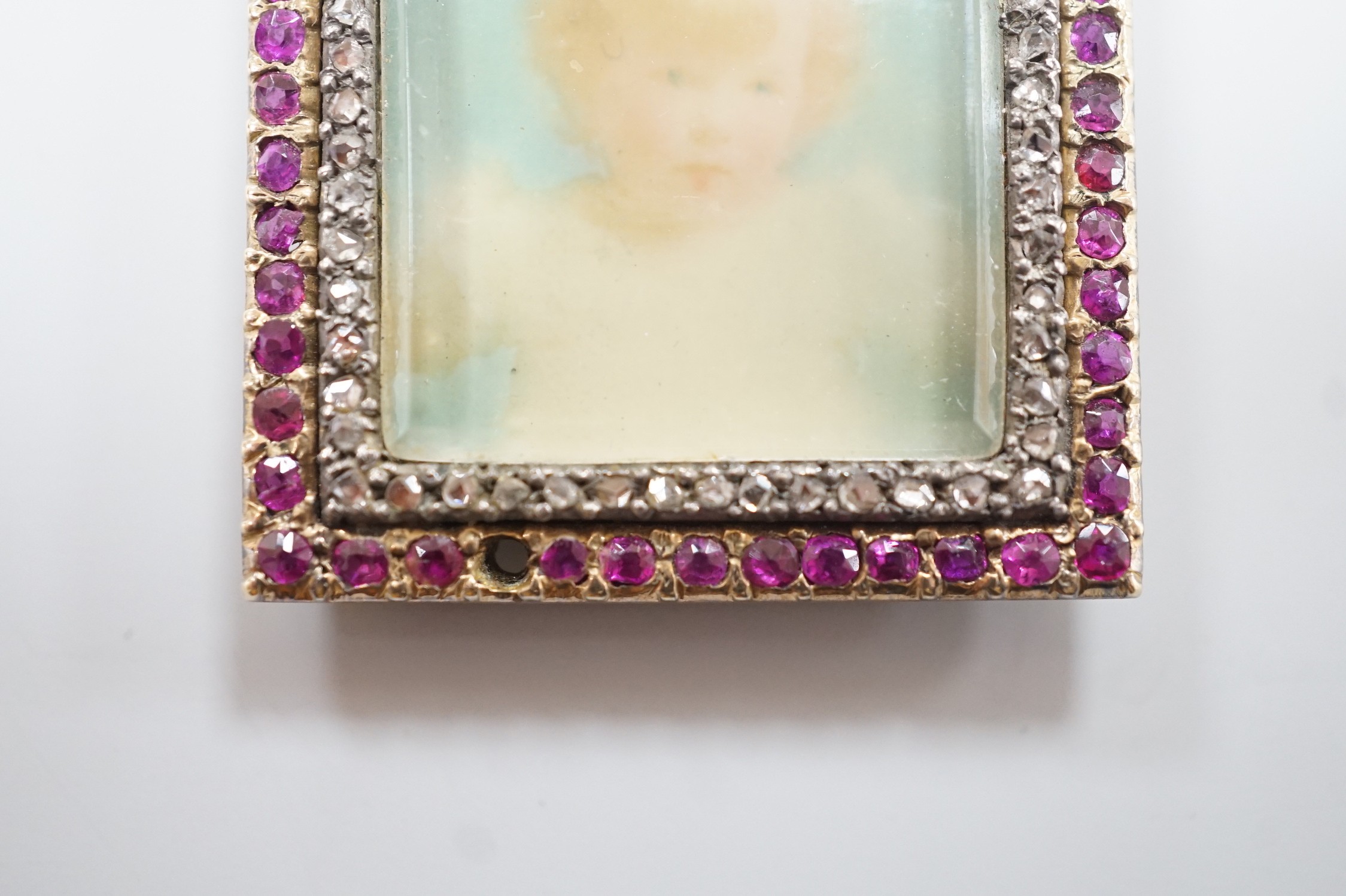 An early 20th century yellow metal, ruby and diamond mounted portrait pendant, 34mm (two rubies - Image 3 of 4