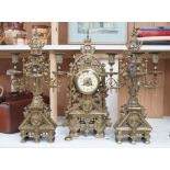 A French Gothic revival bronze clock garniture, c.1900, 56cms high