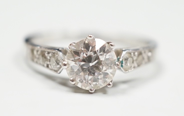 A mid 20th century white metal (stamped Plat) and single stone diamond ring, with diamond set