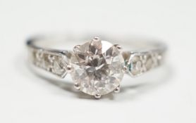 A mid 20th century white metal (stamped Plat) and single stone diamond ring, with diamond set