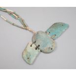 An Egyptian turquoise glazed faience scarab pendant, and cylindrical beads, probably New Kingdom
