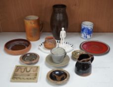 A group of studio pottery including St. Ives Leach pottery jug two dishes and a saucer