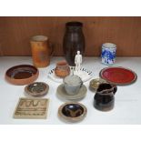 A group of studio pottery including St. Ives Leach pottery jug two dishes and a saucer