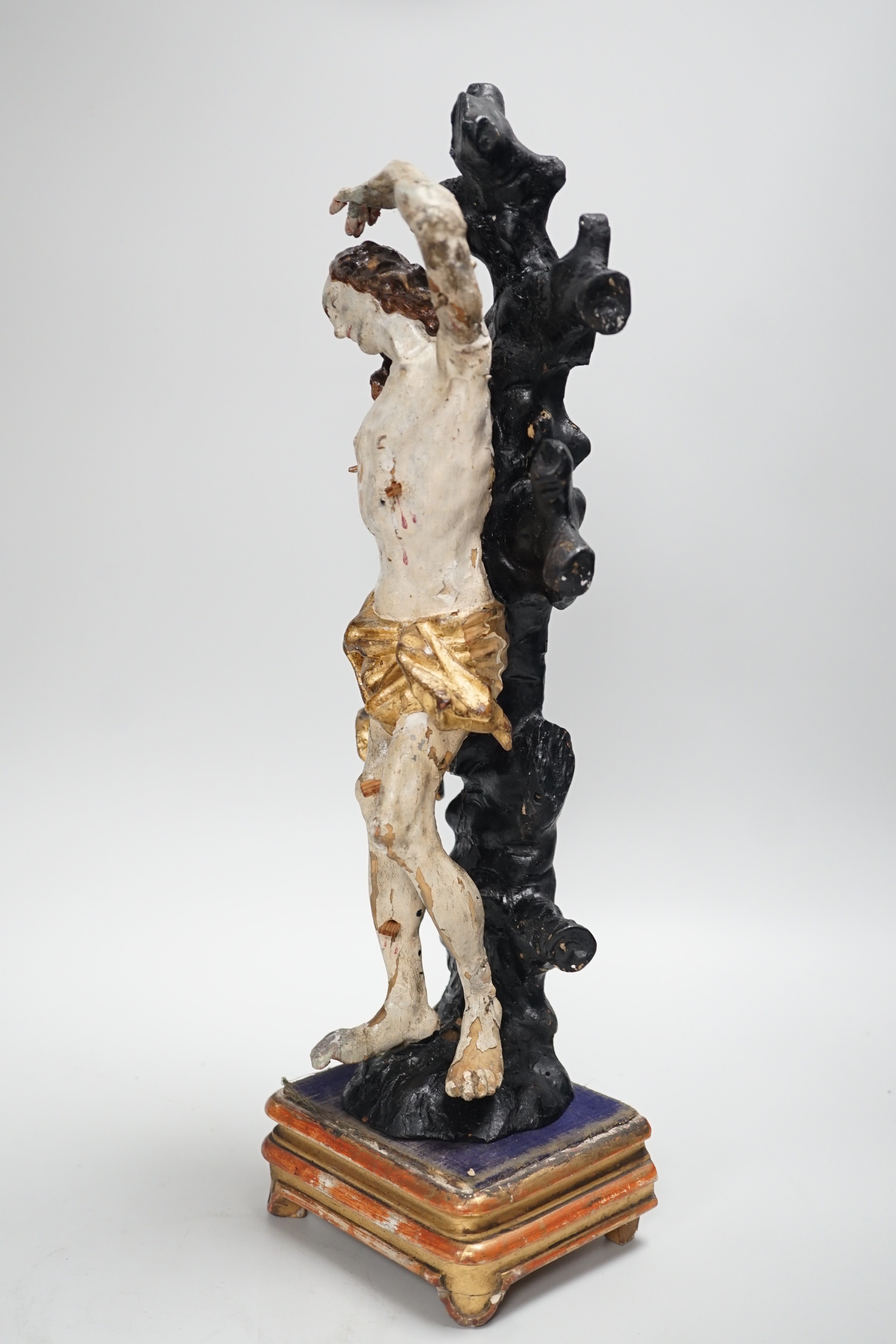 A 19th century Continental carved wooden polychrome figure of St. Sebastian on stand, total height - Image 5 of 6