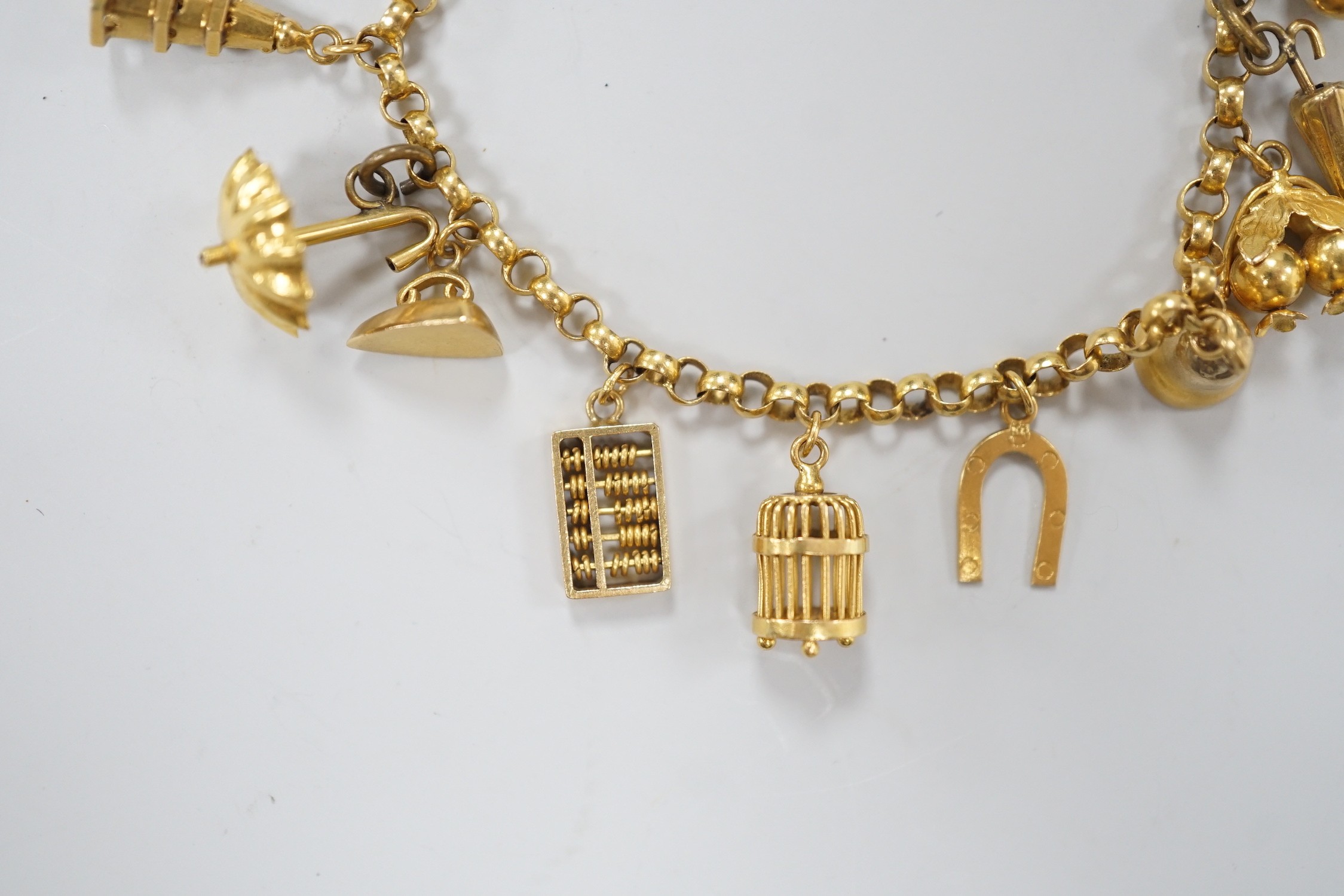 A Chinese yellow metal charm bracelet, hung with thirteen assorted yellow metal charms including - Image 3 of 5