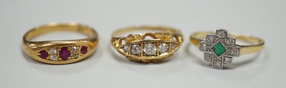 Three early 20th century 18ct and gem set rings, including ruby and diamond chip, size O,