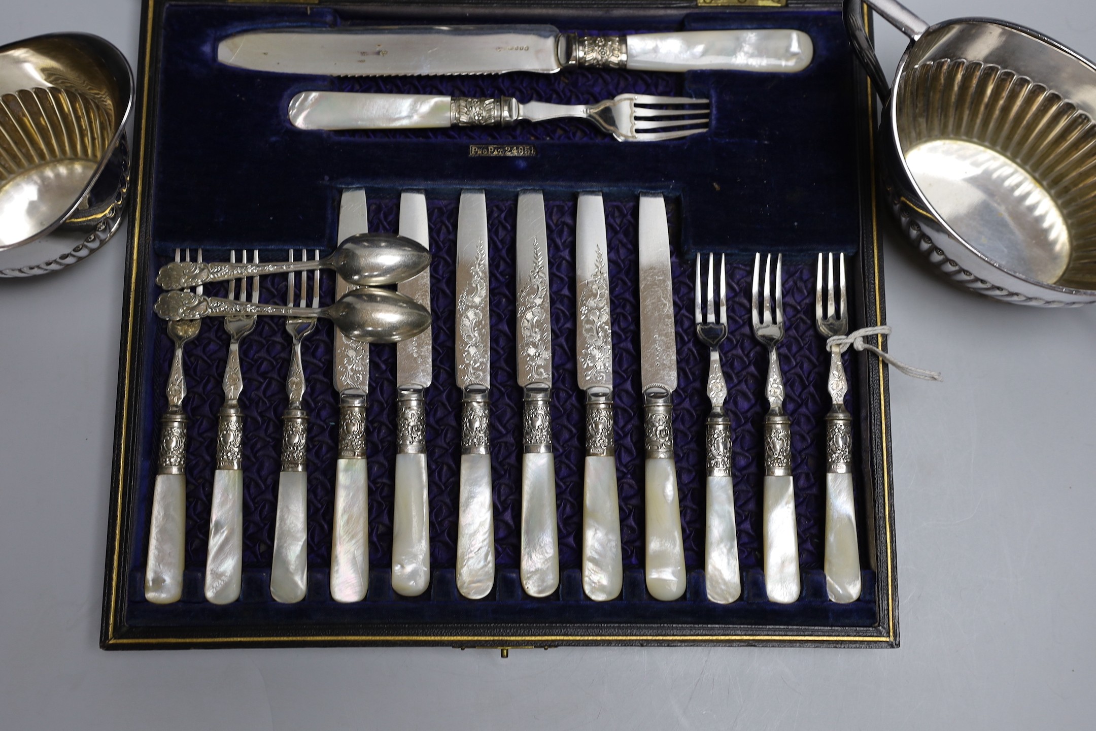 Six pairs of silver plated and engraved dessert knives and forks, with server, mother of pearl - Image 2 of 4