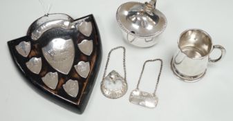A small 1930's silver christening mug, two 19th century silver decanters labels 'Claret' and '