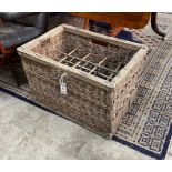 A vintage French 12 bottle wicker crate, width 58cm, depth 38cm, height 40cm