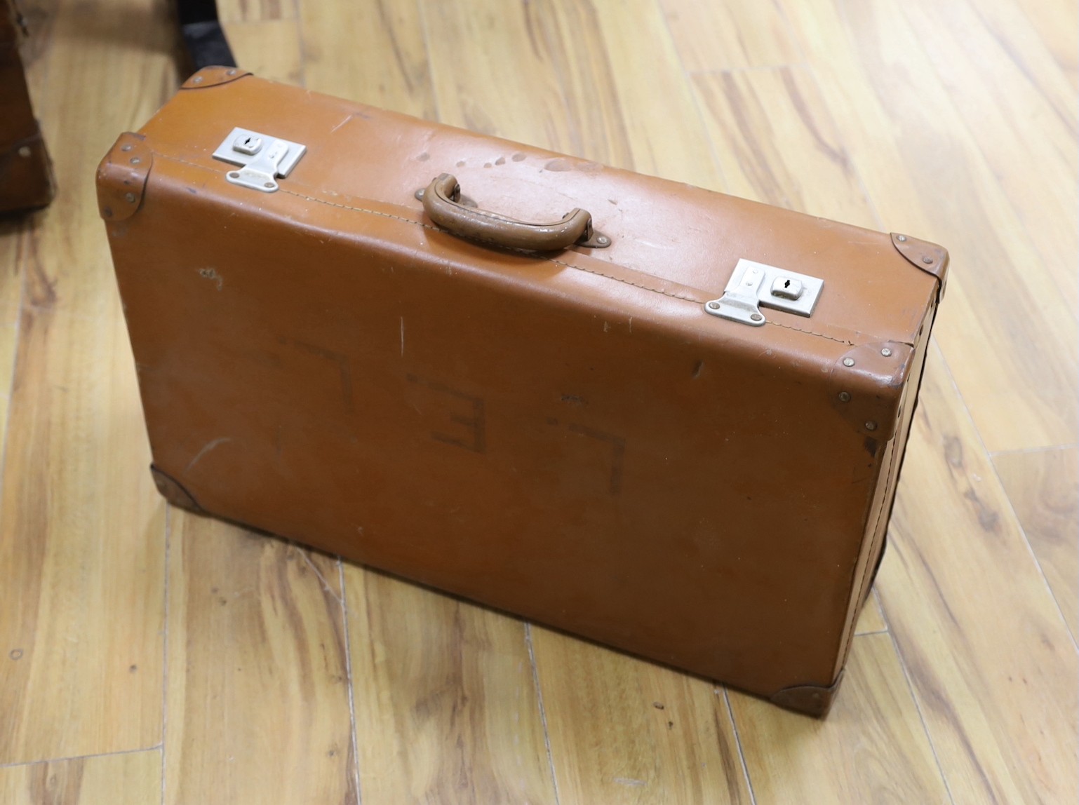 Three early 20th century brown leather cabin trunks and a later vintage suitcase, largest trunk - Image 2 of 4