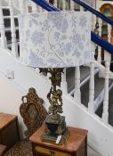 A large cherub stem cast brass five light table lamp with shade, 99cms high including shade