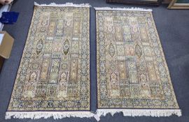 A near pair of North West Persian ivory ground part silk rugs, larger 154 x 95cm