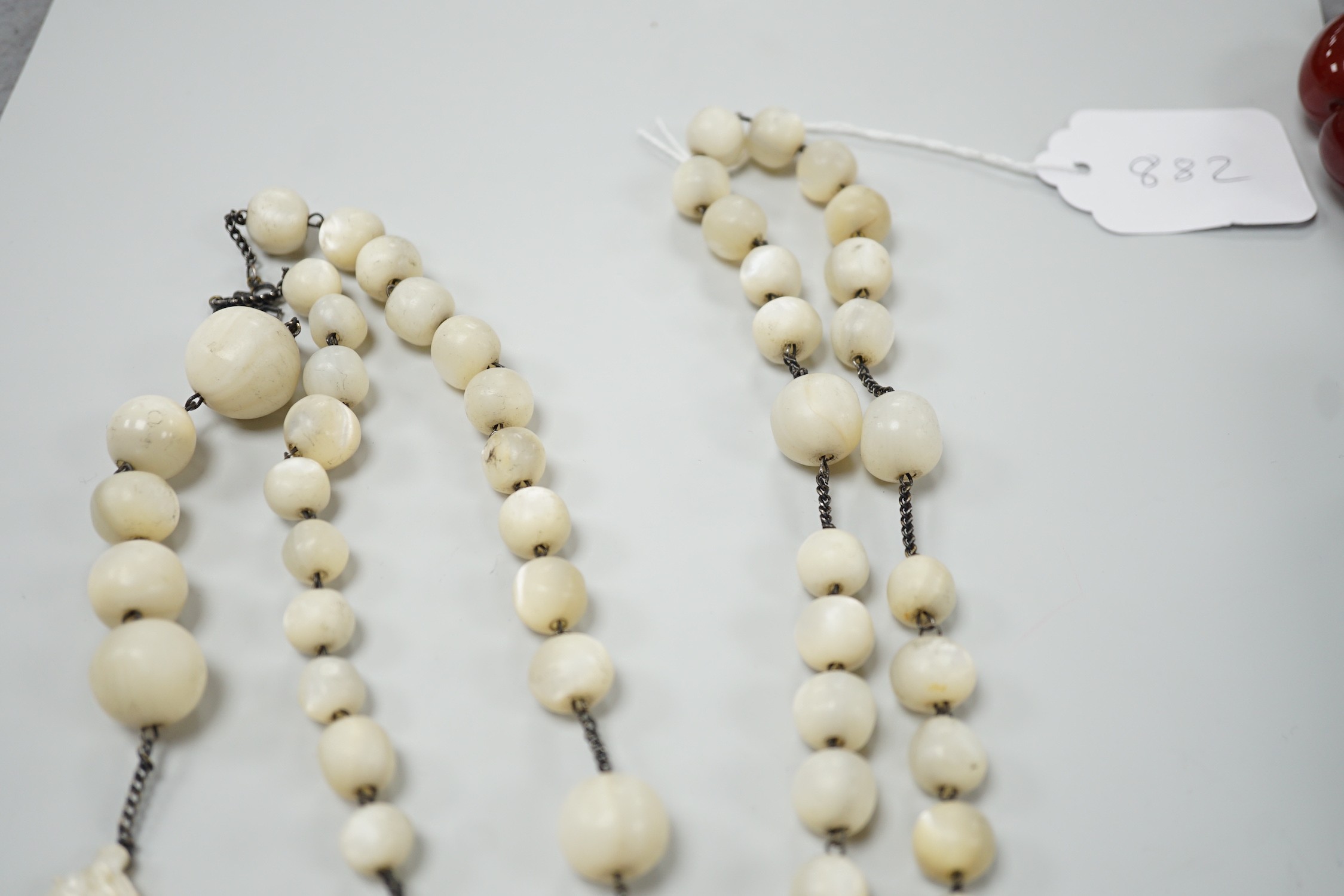 A long mother of pearl multi bead necklace, 158cm, with carved mother of pearl crucifix pendant, - Image 6 of 8