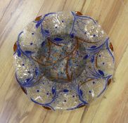 A circular decorative art glass dish, 48cms wide