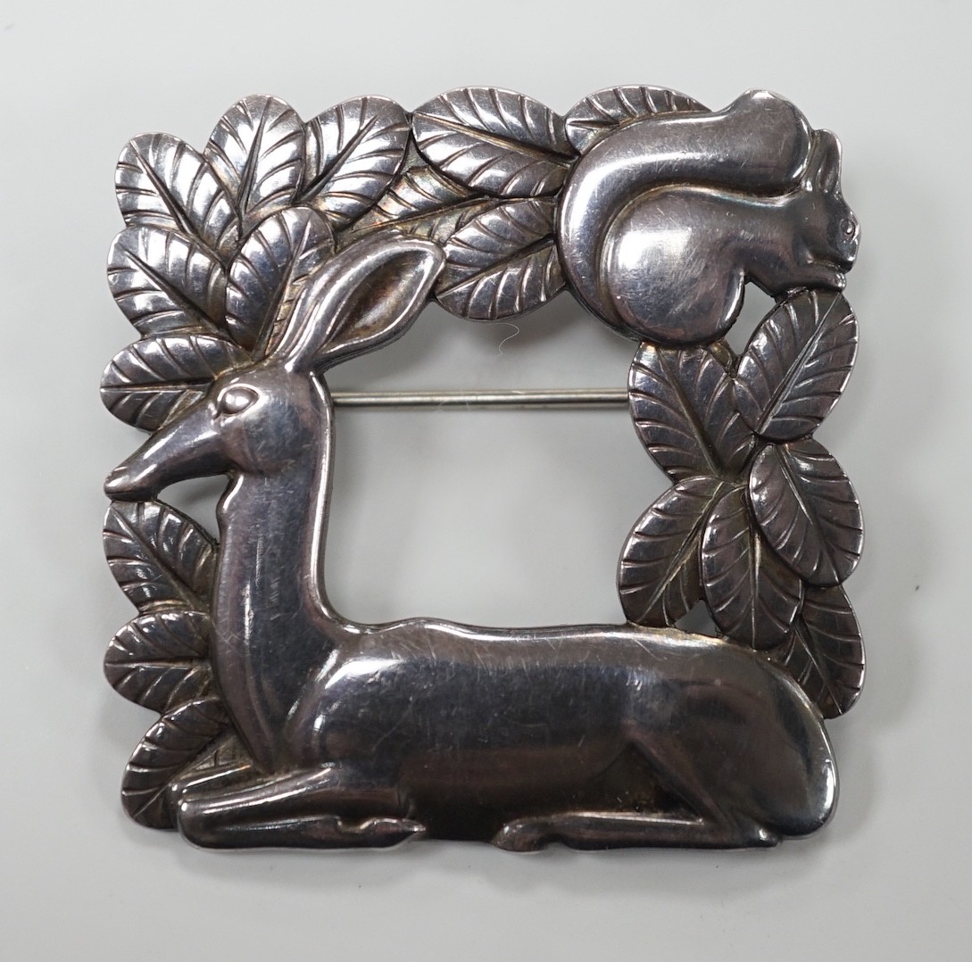 A 1960's Georg Jensen sterling 925 deer and squirrel square brooch, design no. 318, 40mm, with