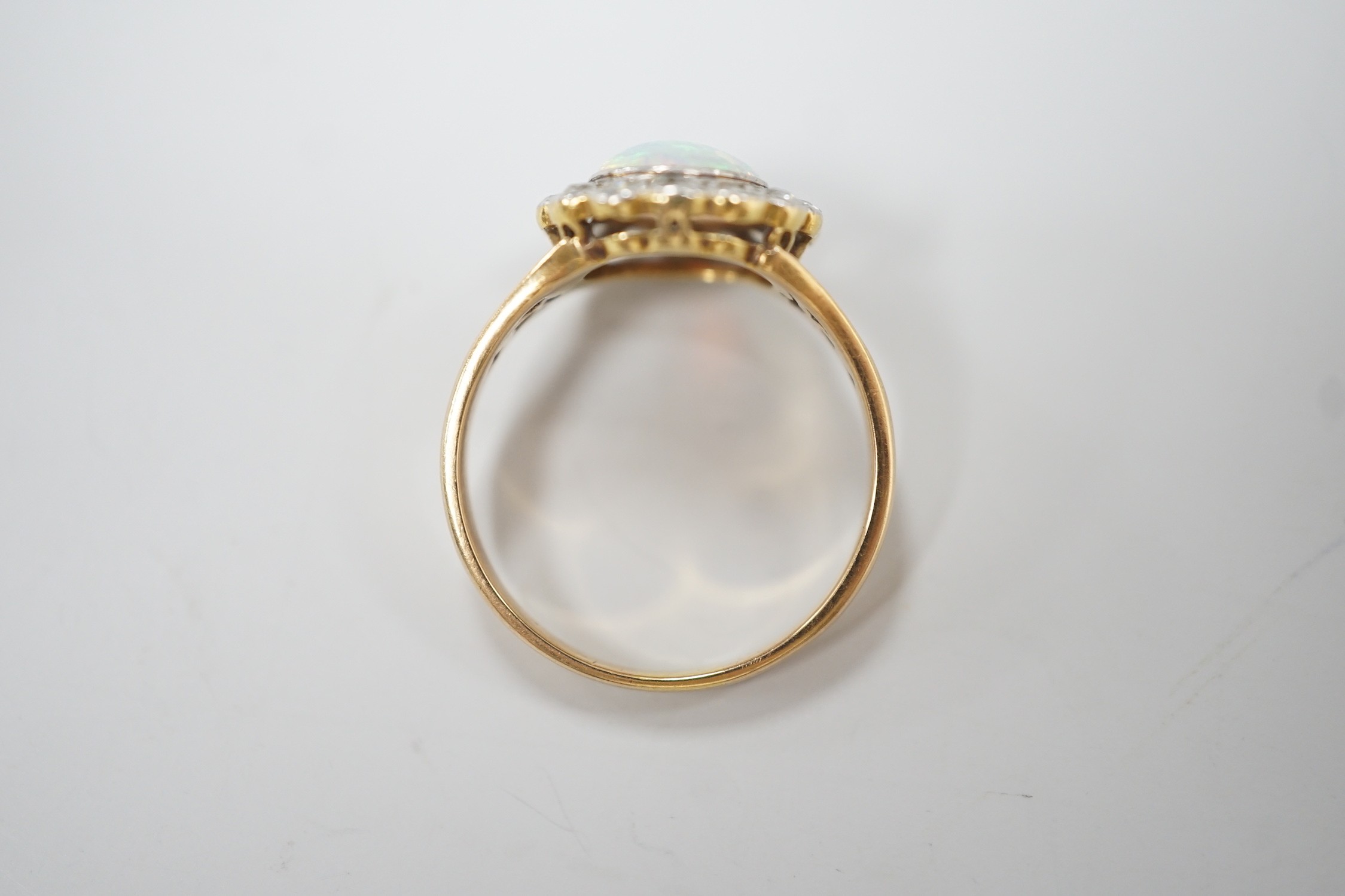 A 1920's? yellow metal, white opal and round cut diamond set circular cluster ring, size O, gross - Image 4 of 4