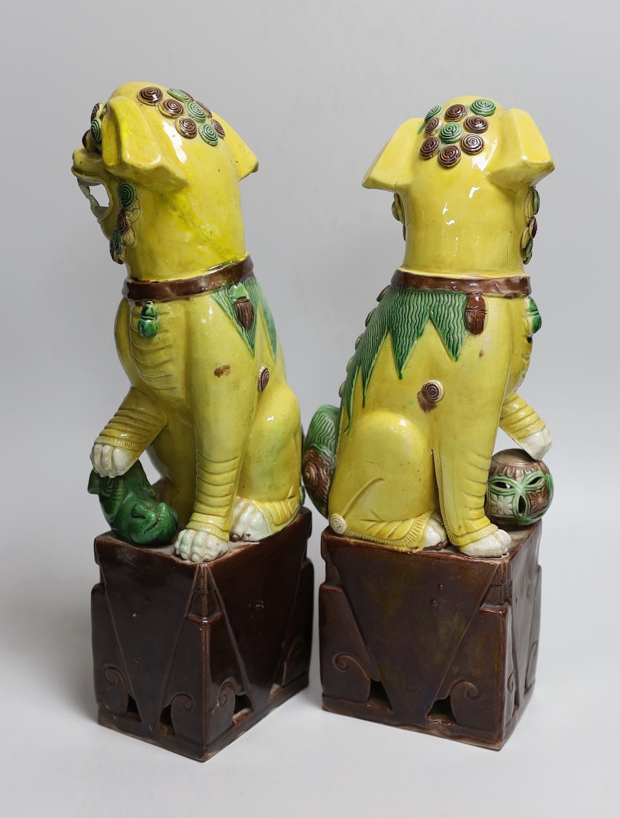 A pair of tall Chinese sancai glazed Buddhist lions, Republic, 36cms high - Image 2 of 4