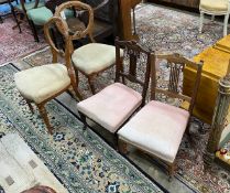 A pair of Victorian carved walnut balloon back dining chairs and a pair of late Victorian nursing