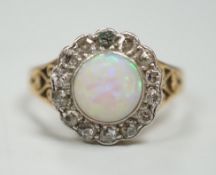 A 1920's? yellow metal, white opal and round cut diamond set circular cluster ring, size O, gross