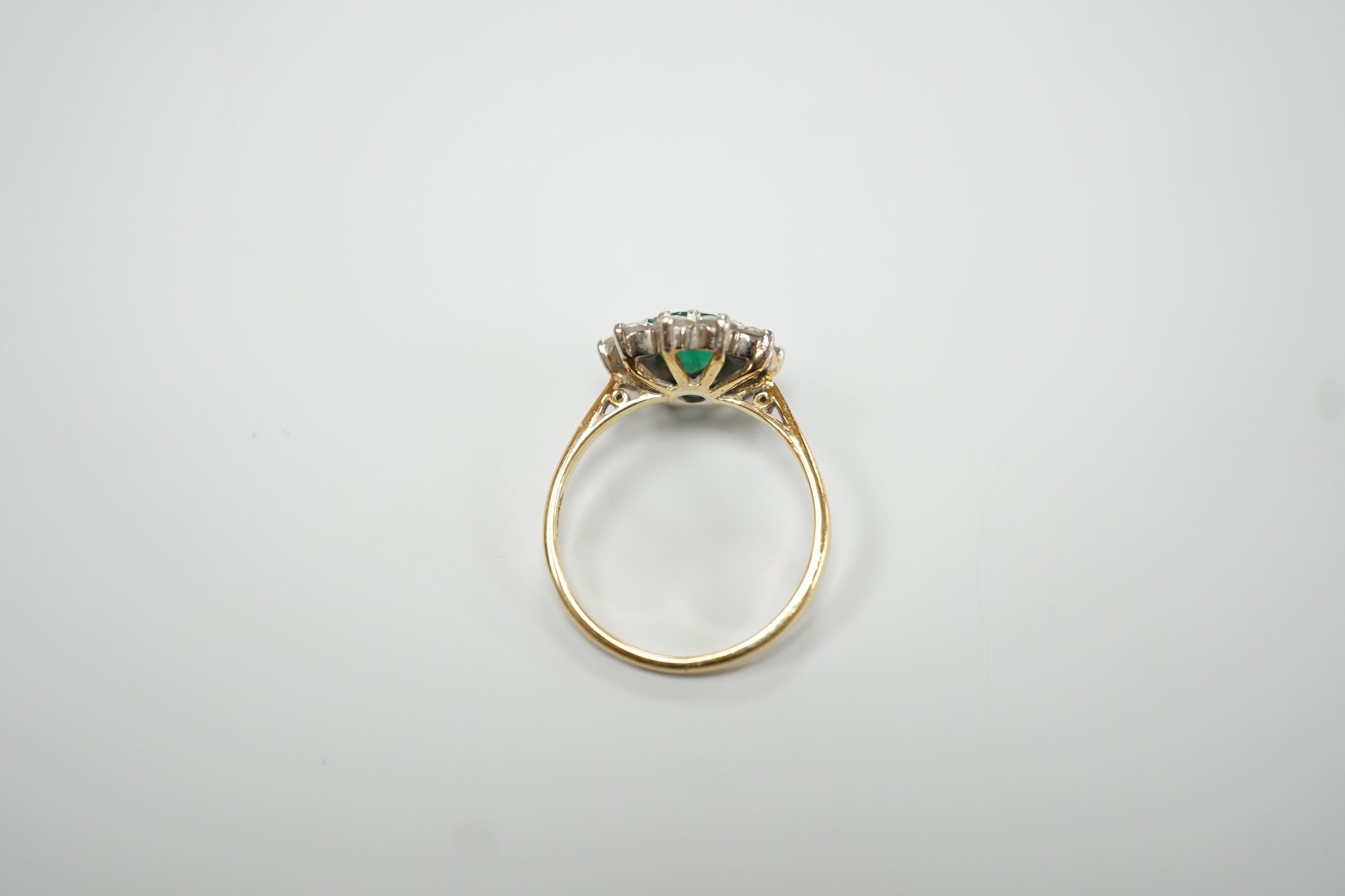 An 18ct, emerald and diamond set circular cluster ring, size K, gross weight 3 grams. - Image 4 of 4