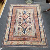 A Caucasian style ivory ground rug, 188 x 133cm