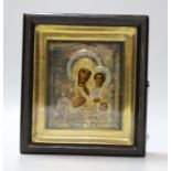 A 20th century Russian painted wood icon of Madonna and Child, with silver-gilt oklad, in gilt