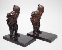 A pair of patinated metal figural bookends, 17cm