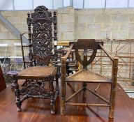 A Carolean style carved oak cane seat highback dining chair together with a chip carved oak chair