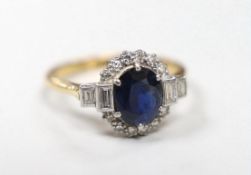An Art Deco 18ct and plat, sapphire and diamond set oval dress ring with baguette cut diamond set