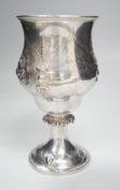 A Victorian silver presentation pedestal cup, embossed with a bull, with later engraved inscription,