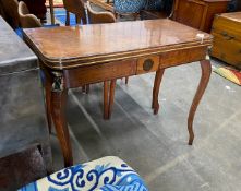 A Regency coromandel banded mahogany folding card table with parcel gilt Egyptianesque metal mounts,