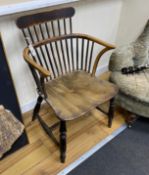 A mid 19th century Windsor ash, elm and beech comb back elbow chair, width 52cm, depth 41cm,
