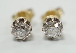 A pair of 585 yellow metal and solitaire diamond set ear studs, each stone weighing approx. 0.15-0.