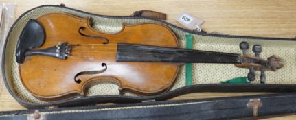 A cased violin, interior label reads ‘copy of Antonius Straduarius made in Germany’, back measures