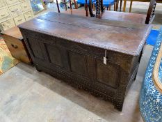 A 17th century carved oak coffer with adapted top, length 142cm, depth 56cm, height 76cm