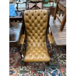 A Victorian style buttoned leather mahogany open armchair, width 63cm, depth 75cm, height 96cm