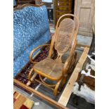 A caned bentwood rocking chair, width 57cm, depth 116cm, height 116cm