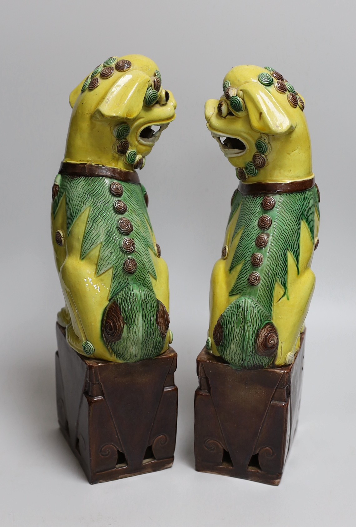 A pair of tall Chinese sancai glazed Buddhist lions, Republic, 36cms high - Image 3 of 4