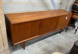 A mid century teak sideboard, length 190cm, depth 43cm, height 79cm