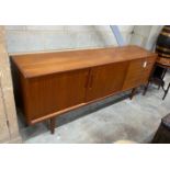 A mid century teak sideboard, length 190cm, depth 43cm, height 79cm