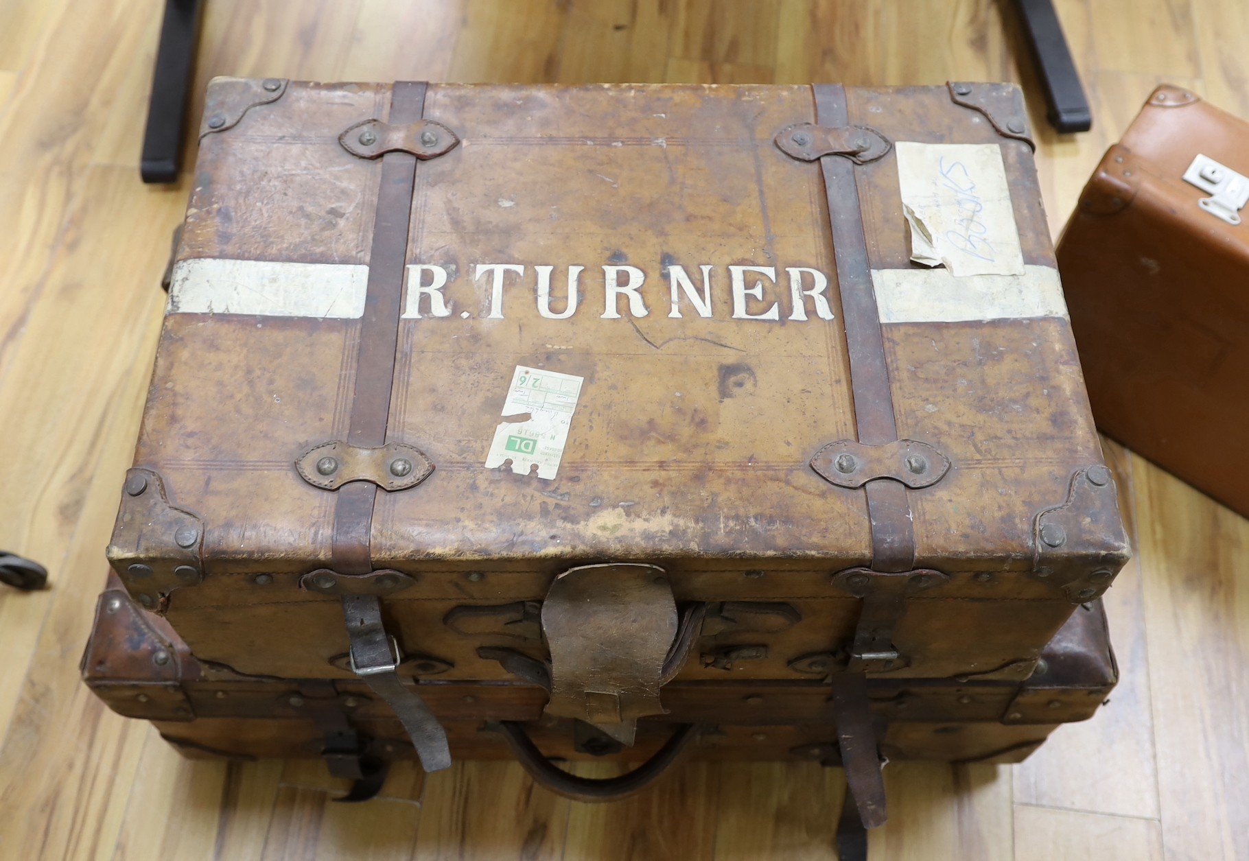 Three early 20th century brown leather cabin trunks and a later vintage suitcase, largest trunk - Image 3 of 4