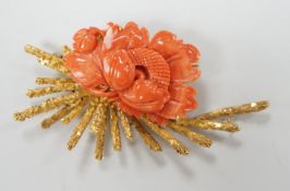 A 1970's? textured 14k yellow metal and carved coral mounted floral spray brooch, 62mm, gross weight