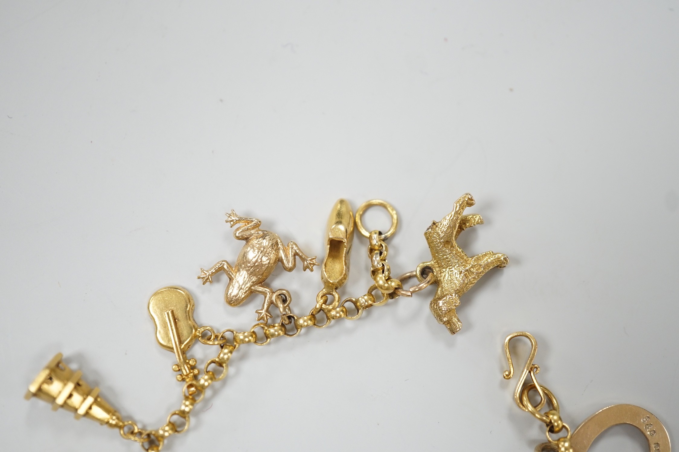 A Chinese yellow metal charm bracelet, hung with thirteen assorted yellow metal charms including - Image 5 of 5